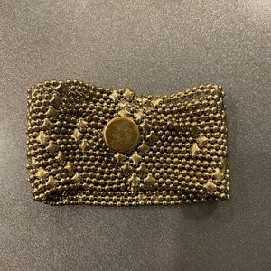 Gold tone snap bracelet